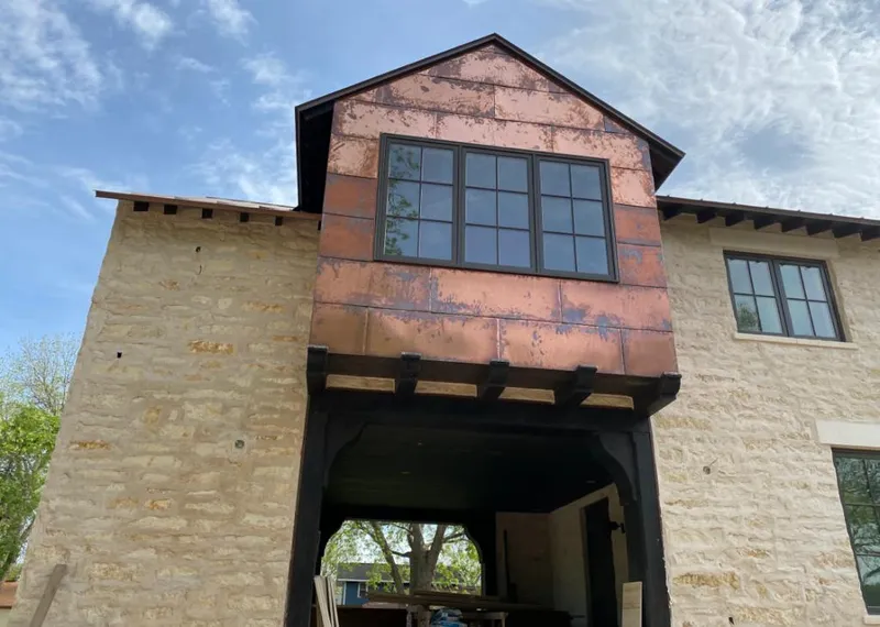 Copper metal panel facade on a stone building for Metal Roof Coating in Garfield